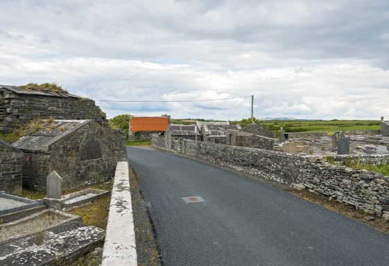 The Dividing Road through  Kilmurry-Ibrickane Church and Graveyard